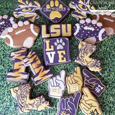 lsu decorated cookies are arranged on the grass