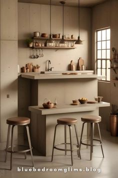 an image of a kitchen setting with stools and counter top in the center area