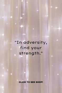 a white curtain with the words, i'm adversity find your strength click to see shop