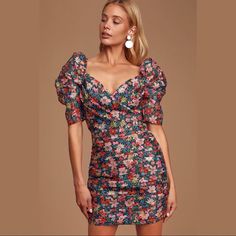 C/Meo (Cameo) Collective Women's And Ever More Puff Sleeve Mini Dress Pump Up The Volume On Your Usual Floral Dress With This Pretty Mini. Exaggerated Puff Sleeves Contrast With A Tailored Bodice And Bring Something Extra To This Silhouette. Fabric: Lightweight, Non-Stretch Weave Floral Print Ruched Detailing Throughout Mini Dress Cut With Short Puff Sleeves Sweetheart Neckline Hidden Zip At Back Shell: 100% Polyester Lining: 100% Polyester Wash Cold Or Dry Clean Color: Black Garden Floral Chic Fitted Floral Dress With Puff Sleeves, Fitted Puff Sleeve Floral Dress For Brunch, Spring Floral Puff Sleeve Fitted Dress, Floral Print Puff Sleeve Dress For Party, Fitted Floral Print Sheath Mini Dress, Party Floral Dress With Puff Sleeves, Feminine Fitted Multicolor Mini Dress, Chic Floral Short Sleeve Dress For Date Night, Chic Fitted Floral Dress For Night Out