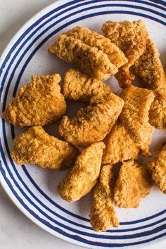 fried chicken pieces on a blue and white plate