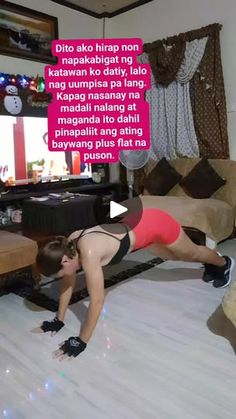 a woman is doing push ups in her living room