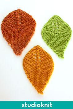 three knitted leaves sitting next to each other