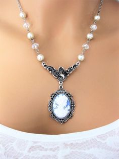 "Classic Victorian Lady Cameo Necklace handmade by Ralston Originals. Click to see all the colors. These cameo necklaces are made with Victorian lady face cameos, in your choice colors; blue, dark blue, black, brown, purple, pink, or dark pink cameos. The cameo is in a beautiful ornate antique silver setting, then attached to a unique antique silver connector that really sets off the importance of the cameo. Followed by the classic Victorian look with white pearl beads, and sparkling clear cryst Elegant Cameo Necklaces For Wedding, Elegant Cameo Necklace For Wedding, Bohemian Cameo Necklace For Gift, Cameo Pendant Necklace For Wedding, Titanic Ii, Antique Cameo Jewelry, Lady Face, Beautiful Beaded Jewelry, Cameo Pendant Necklace