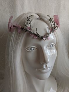 This gorgeous woodland tiara features pink leaves surrounding the naturally wrapped base, and a gorgeous moon and branches decorating the center. A matching pink gem is set in the middle of the moon and large pink ombre leaves decorate the sides. Perfect for any occasion you choose or to add a magical touch to your everyday! Choose between silver charms as pictured or bronze! Pink Crown Headpiece For Wedding, Pink Wedding Crown Headpiece, Whimsical Pink Crown Headpiece, Pink Whimsical Headband Headpiece, Whimsical Pink Headpieces As Gift, Whimsical Pink Headpieces For Gifts, Handmade Pink Wedding Headpiece, Handmade Pink Headpiece As A Gift, Pink Headband Gift Headpieces