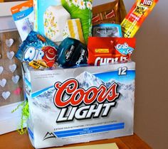 a bag filled with candy and snacks sitting on top of a wooden table next to a white box