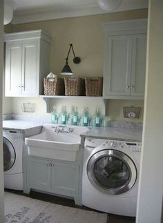 a white washer and dryer sitting inside of a kitchen