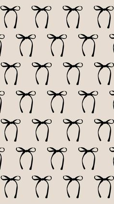 black and white bows on a light gray background seamless wallpaper, pattern or backdrop