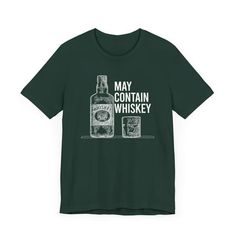 a green t - shirt that says may contain whiskey on the front, and an image of