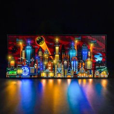 an illuminated cityscape is shown in the dark