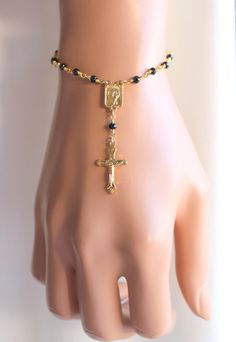 "This is a beautiful 18kt gold filled rosary style bracelet or anklet made with 3mm faceted black spinal stones and features a small crucifix cross pendant. This high quality ankle bracelet may be ordered in bracelet or anklet length, please choose size. Cross pendant measures 18x11mm, center Mary medallion measures 10x7mm. Spring clasp sits in back.If you prefer a plain cross you may request one at checkout. Comes nicely boxed for the perfect gift! May be ordered with other gemstone colors garn Catholic Jewelry Necklace, Black Rosary, 14kt Gold Jewelry, Gold Rosary, Clean Sterling Silver, Catholic Jewelry, Gold Anklet, Rosary Bracelet, Wedding Jewelry Bracelets