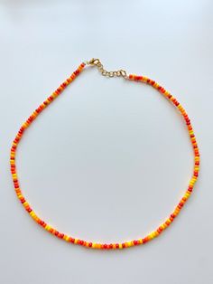 "the \"autumn leaves\" necklace is a seed bead necklace! it's so cute and it's perfect for layering! not recommended for children under 8 as small objects could present as a choking hazard." Red And Yellow Beaded Necklace, Autumn Necklace Fall Jewelry, Yellow Beaded Necklace, Leaves Necklace, Autumn Necklace, Doll Jewelry, Small Objects, Fall Jewelry, Seed Bead Necklace