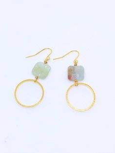 Handmade in Portland, Oregon. This will make the perfect gift! Or, definitely get it for yourself, I support that, too. MEASUREMENTS + MATERIALS - Length is about 1.5 inches - Pretty raw aquamarine gemstone - Hoop is about 1 inch in diameter - Gold fill ear wire for sensitive skin (hypoallergenic) WHAT PEOPLE SAY “Beautiful craftsmanship, these were for my mother in law, she loves them. I love supporting small businesses.” - Josh “ Love these earrings!! I get so many compliments about them when Handmade Modern 14k Gold Filled Jewelry, Handmade Gold Aquamarine Earrings, Minimalist Gold Aquamarine Jewelry, Aquamarine Round Jewelry With Matching Earrings, Aquamarine Matching Earrings Jewelry, Gold Aquamarine Gemstone Earrings, Gold Aquamarine Round Jewelry, Round Aquamarine Gold Jewelry, Handmade Aquamarine Round Jewelry