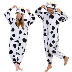 two people in costumes that are standing up with their hands on their hipss and one is wearing a cow costume