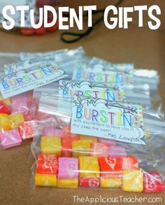 three bags filled with different colored dices and the words student gifts written on them