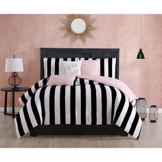 black and white striped bedding with pink accents