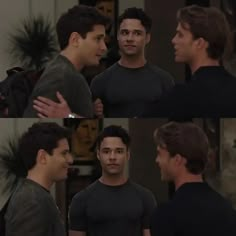 two men are talking to each other in front of a mirror and another man is looking at him