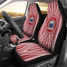 the interior of a car with red and white seat covers