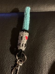 a keychain with a hello kitty design on it