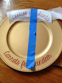 a paper plate with a blue ribbon on it