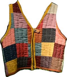 a vest made out of different colored squares