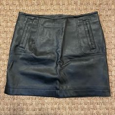 - Material: 100% Polyester (Faux Leather) - Color: Black - Condition: Never Worn! No Rips, Tears, Or Stains. - Style: Flattering, Form-Fitting Mini Skirt With Pockets! Pockets Are Real. Small Black Zipper With A Button On The Left Side Of The Skirt. - Size: Women’s 8 - Skirt Length (From Waistband To Bottom Of Skirt): 16” - Waist Circumference: 31” Fitted Leather Mini Skirt With Pockets, H&m Mini Skirt For Fall Workwear, Fall Workwear Mini Skirt By H&m, Chic H&m Mini Skirt For Fall, H&m Black Mini Skirt For Work, Faux Leather Mini Skirt, Hm Skirt, Leather Mini Skirt, Skirt With Pockets