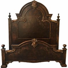 the headboard and foot board are made out of wood with intricate carvings on it