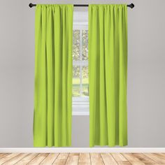 a bright green curtain hanging in front of a window