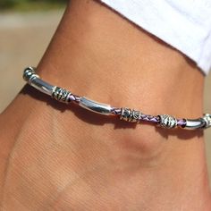 Introducing the Rayette Braided Leather & Silver Anklet - a summer essential that will add a bit of colorful flair to your look! With a single braided leather strand adorned with shiny silver-plated beads and crescents. The stainless steel clasp ensures a secure fit all day long - so now you can look fabulous and forget about it! This unique design is a beauty that looks fantastic with any shade of denim. Try this bracelet with the Austin earrings. single round braided leather strand silver plat Single Braid, Silver Anklet, Summer Essential, Silver Anklets, Purple Leather, Leather Silver, Braided Leather, Shiny Silver, Summer Essentials