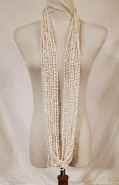 "12 Strands about 56\" White or Beige Nassa Shell Necklace Lei Hawaiian Set Graduation Wedding Birthday Luau Loop Lei is made with  Nasa Shells, each shell is approximately 2-4mm, around 56\"  in length, strung with strong string. It comes in a set of 12 strand, you can wear it together or separated. Loop it around to wear it short, or long, style it to your liking.  Shipping from Pearl City, Hawaii 96782" Pearl City Hawaii, Birthday Luau, Candy Lei, Hawaiian Lei, Surfer Necklace, Private Island, Shell Necklace, Cowrie Shell, Wedding Jewellery Necklace