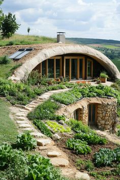 an unusual house built into the side of a hill