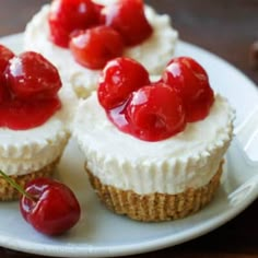 there are cherries on top of the cupcakes