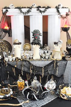 a table topped with lots of halloween decorations