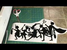 the silhouettes of children are cut out to look like they're dancing together