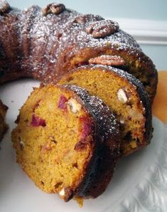 a bundt cake on a plate with one slice cut out