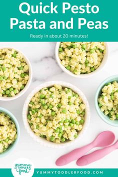 four bowls filled with peas and rice next to pink utensils on a white table