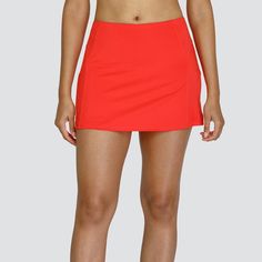 Get ready to dominate the court in the Tail Womens Dolly 135 Inch Tennis Skort in Carmine This tennis skort is made of a soft Glamor Jersey It has side swirl inserts and elegant stitching across the hips It also has a straight hem and builtin pair of shorts This very breathability highly flexible skort pairs perfectly with other apparel by Tail Be sure to check it out today and stay inspiredSizesXSMALL SMALL MEDIUM LARGE XLARGE XXLARGEColor CarmineMaterial 88 Polyester 12 Spandex Solid Mini Skort For Sports, Solid Color Mini Skort For Sports, Solid Mini Length Tennis Skirt, Fitted Mini Skirt With Built-in Shorts For Tennis, Sporty Red Skort For Summer, Mini Skirt For Cheerleading, Short Length Mini Skirt For Cheerleading, Sporty Fitted Swim Skirt For Sports, Solid Color Short Tennis Mini Skirt