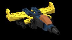 an image of a lego airplane made out of yellow and blue bricks on a black background