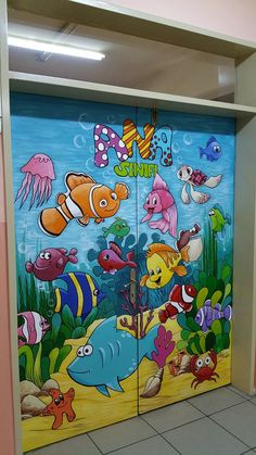 an open door with fish and sea animals painted on it