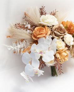 an arrangement of flowers on a white background