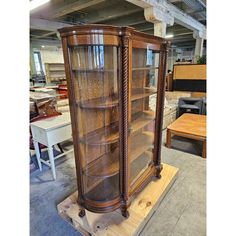 a large wooden display case with glass doors