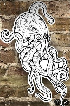 an octopus sticker on a brick wall