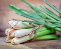 asparagus tied up on a cutting board