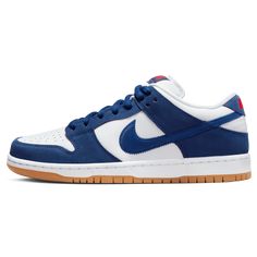 Dressed in a Deep Royal Blue, White, Sport Red, and Gum Light Brown colour scheme. This offering of the Nike SB Dunk Low features a White leather base with Dodger Blue suede overlays and Red branded tongues and heels. Other notable details includes palm trees and the “Welcome to Dodger Stadium” graphics on the inner tongue tags. A White midsole atop a Gum rubber outsole with Pink bubble gum marks on the right heel completes the design. Nike Skateboarding, Nike Sb Dunk Low Pro, Dodger Blue, Dodger Stadium, Nike Models, Deep Royal Blue, Nike Sb Dunk Low, Stunning Shoes, Sb Dunk Low