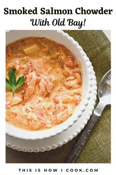 a bowl of smoked salmon chowder with old bay on the side and text overlay reads smoked salmon chowder with old bay