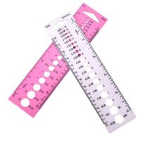 two pink rulers with holes on each side