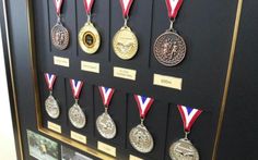 the medals are displayed in a shadow box