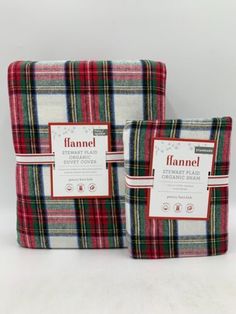 two flannel blankets sitting next to each other