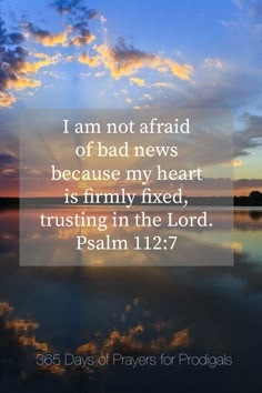 a sunset with the words i am not afraid of bad news because my heart is firmly fixed, trusting in the lord