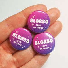 three purple buttons that say blobbo from my shoes, from my shows